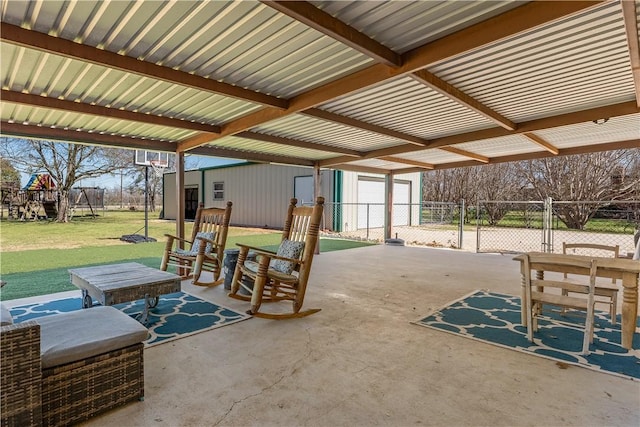 view of patio with an outdoor structure, a gate, and fence