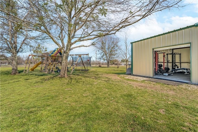 view of yard with an outbuilding, playground community, and a pole building