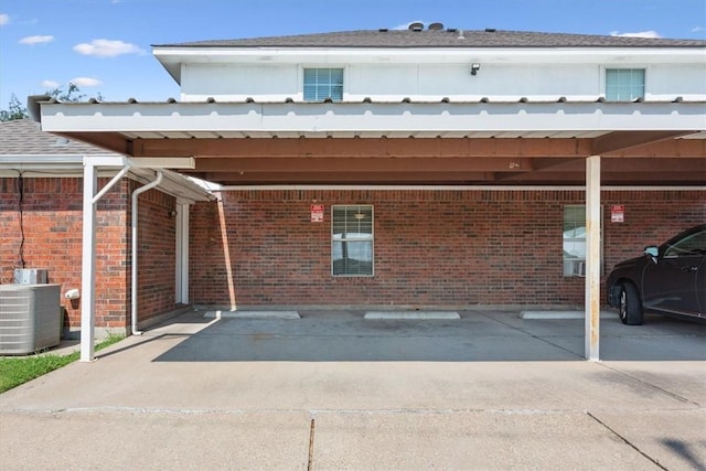 view of parking / parking lot featuring a carport