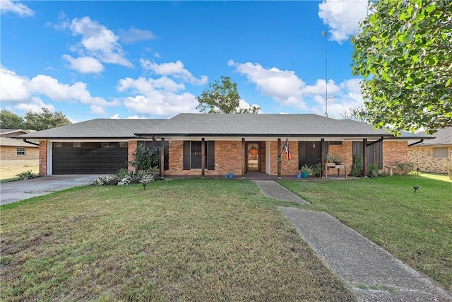 ranch-style home with a garage and a front lawn