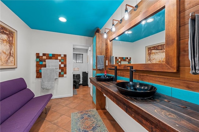 bathroom featuring tile patterned flooring and vanity