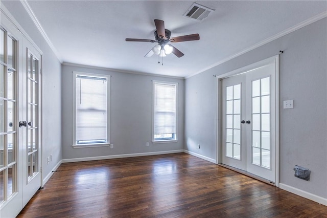 empty room featuring crown molding, dark hardwood / wood-style floors, french doors, and ceiling fan