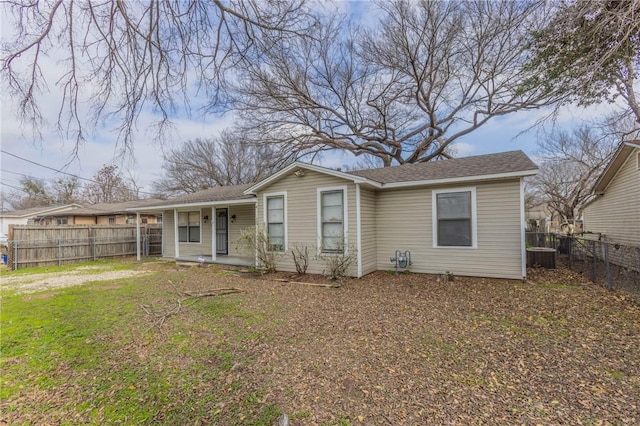 view of front facade featuring a front lawn, central air condition unit, and a porch