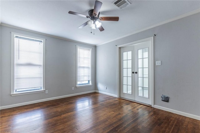 spare room with dark hardwood / wood-style flooring, crown molding, french doors, and ceiling fan