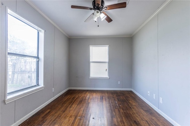 spare room with ceiling fan, ornamental molding, and dark hardwood / wood-style flooring