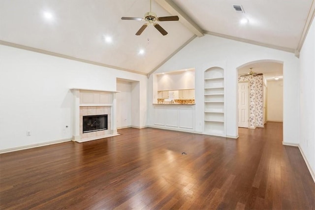 unfurnished living room featuring dark wood-type flooring, ceiling fan, and lofted ceiling with beams