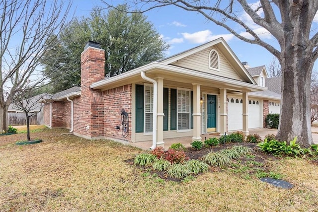 view of front of house with a garage and a front yard