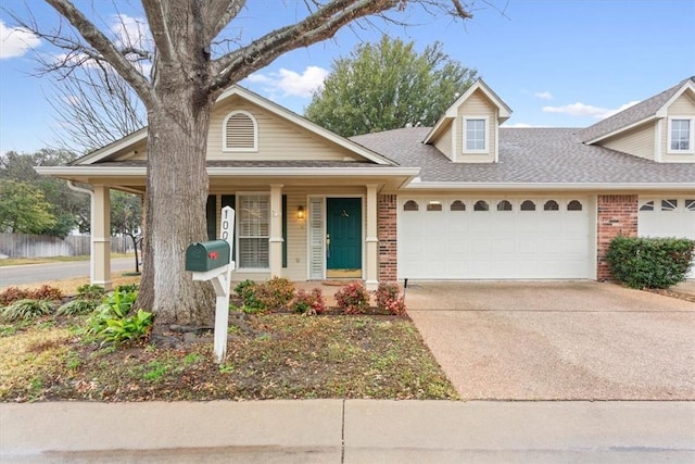 view of front of home with a porch and a garage