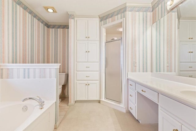 full bathroom featuring shower with separate bathtub, vanity, and toilet