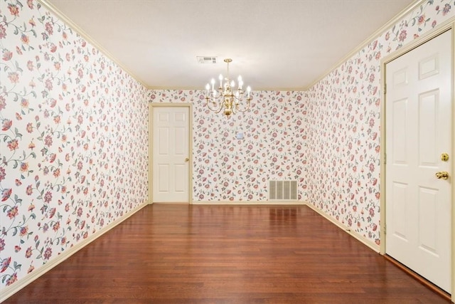 unfurnished dining area with hardwood / wood-style flooring, ornamental molding, and a chandelier