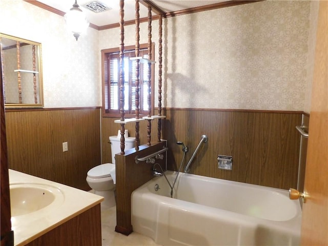 bathroom with wallpapered walls, visible vents, toilet, a wainscoted wall, and a garden tub