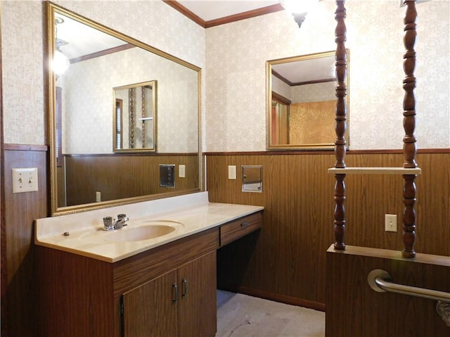 bathroom with a wainscoted wall, vanity, and wallpapered walls