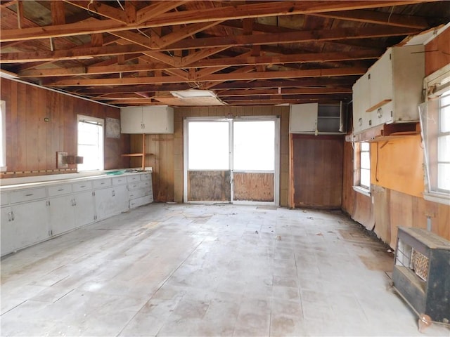 miscellaneous room featuring wooden walls