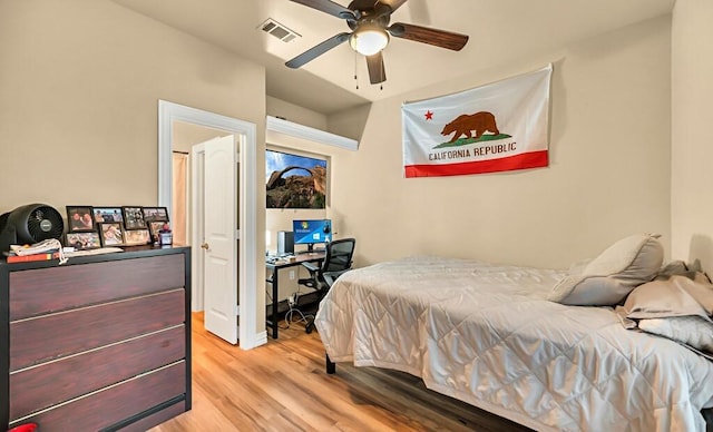 bedroom with ceiling fan and light hardwood / wood-style flooring