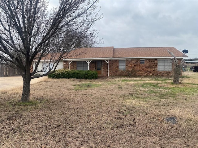 ranch-style house with a front lawn