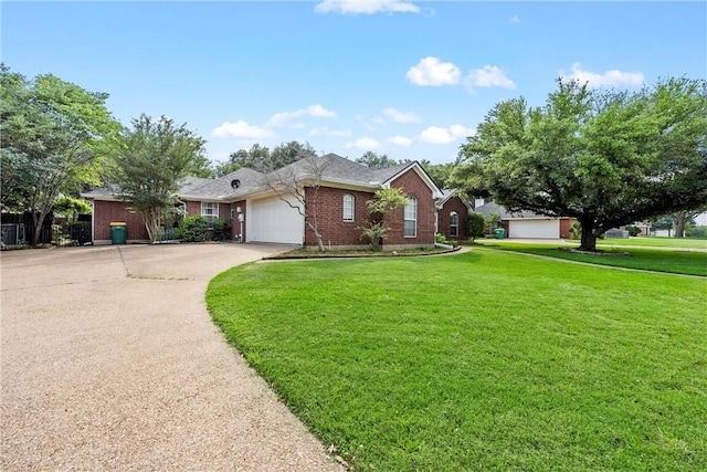 ranch-style home featuring a front yard and a garage