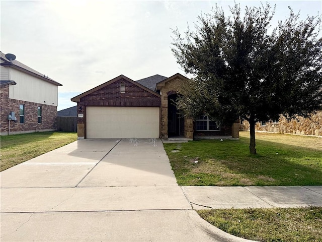 view of front facade featuring a garage and a front yard