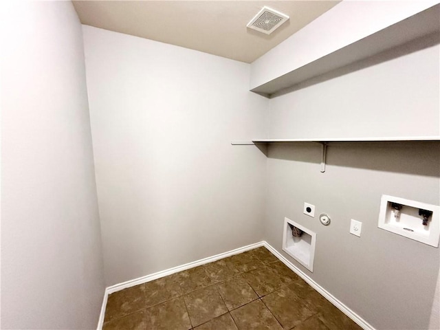 laundry room with electric dryer hookup, washer hookup, hookup for a gas dryer, and dark tile patterned flooring