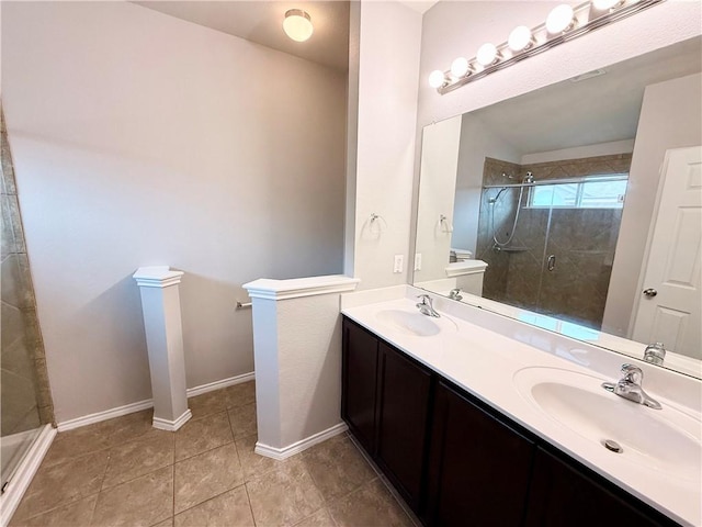 bathroom featuring vanity, a shower with shower door, and tile patterned floors