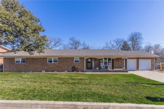 ranch-style house with a garage, a front lawn, and covered porch