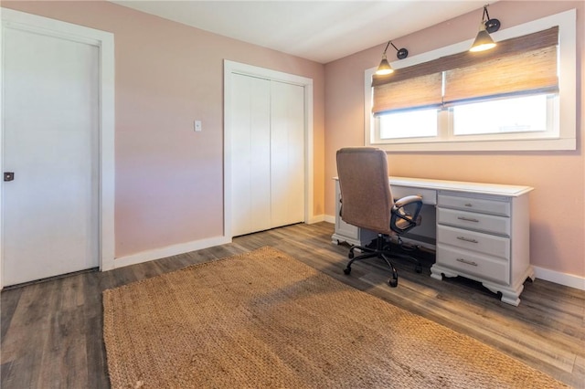 unfurnished office featuring dark hardwood / wood-style floors