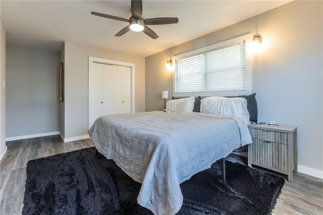 bedroom featuring wood-type flooring, a closet, and ceiling fan