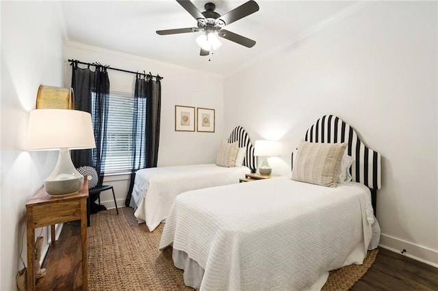 bedroom featuring dark hardwood / wood-style floors, ceiling fan, and crown molding