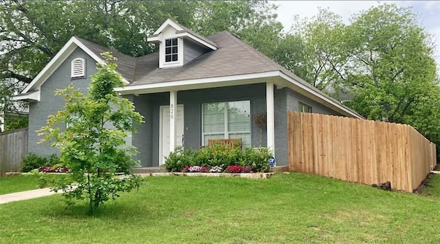 view of outbuilding featuring a porch and a yard