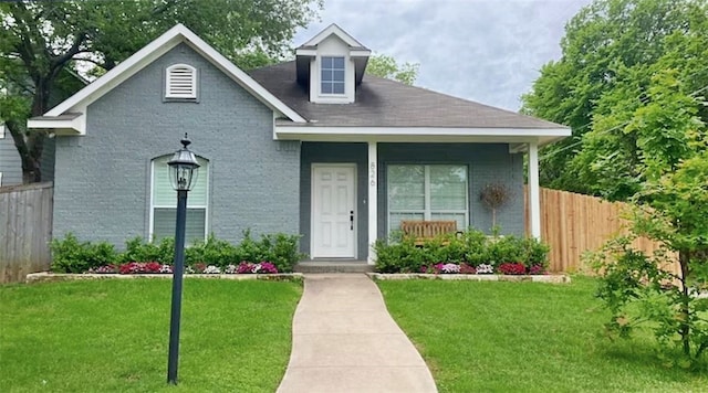 view of front of home featuring a front lawn and a porch