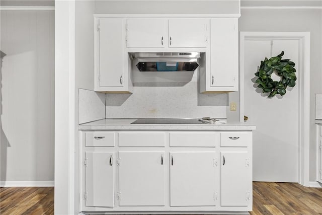 kitchen with white cabinetry, dark wood-type flooring, and black electric cooktop