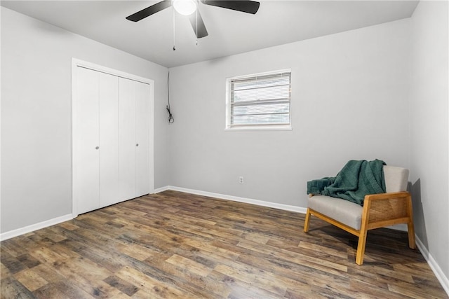 living area with ceiling fan and wood-type flooring