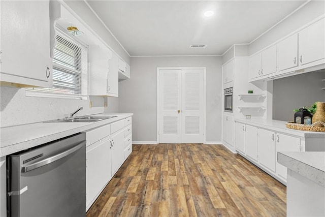 kitchen featuring white cabinets, dark hardwood / wood-style floors, sink, and stainless steel appliances