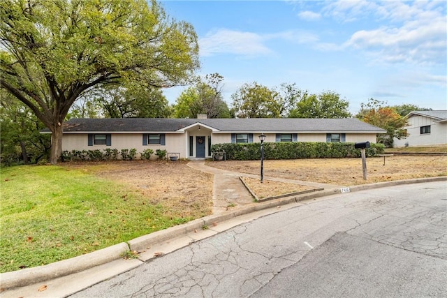 single story home with a front yard