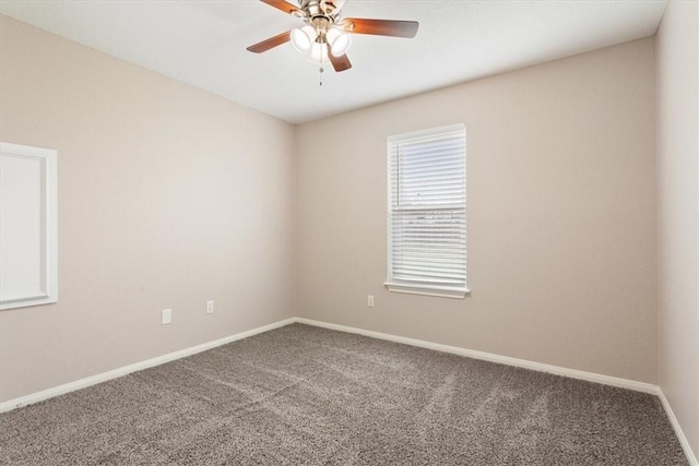 empty room featuring carpet, baseboards, and ceiling fan