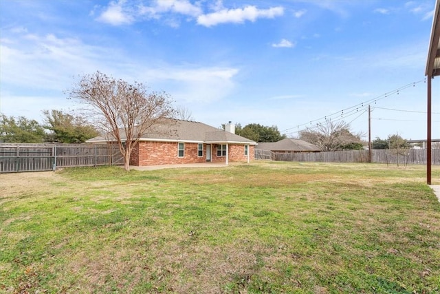 view of yard featuring a fenced backyard