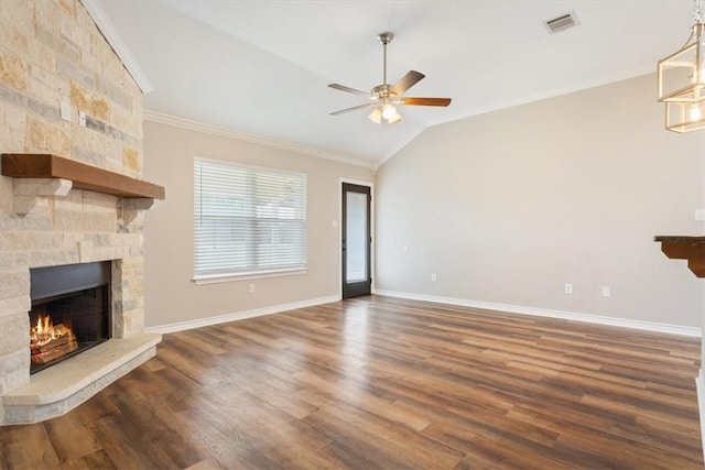 unfurnished living room with lofted ceiling, a fireplace, visible vents, dark wood-style floors, and crown molding