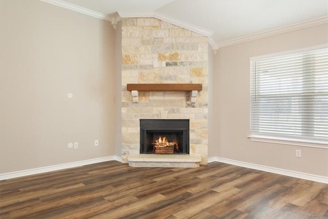 unfurnished living room featuring a fireplace, crown molding, baseboards, and wood finished floors