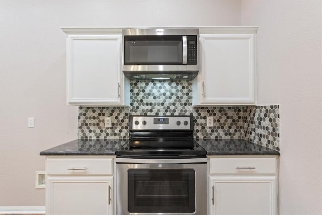 kitchen with stainless steel appliances, white cabinetry, and decorative backsplash