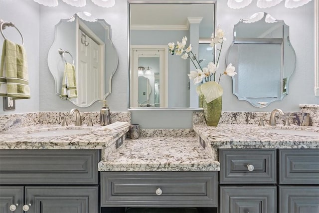 bathroom with vanity and crown molding