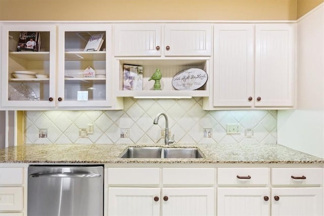 kitchen with white cabinetry, sink, backsplash, and dishwasher