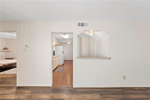 spare room with dark hardwood / wood-style floors