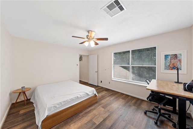 bedroom featuring ceiling fan and dark hardwood / wood-style floors