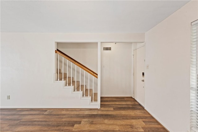 foyer entrance with dark wood-type flooring