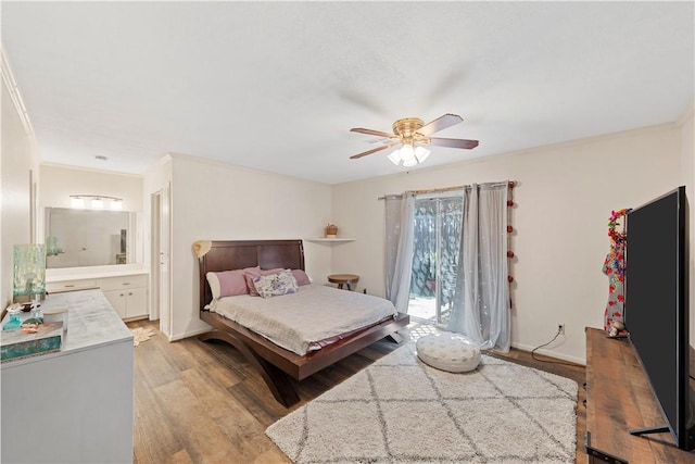 bedroom with connected bathroom, ceiling fan, light hardwood / wood-style flooring, and ornamental molding