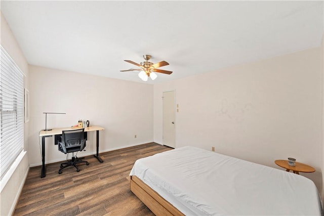 bedroom featuring dark hardwood / wood-style floors and ceiling fan