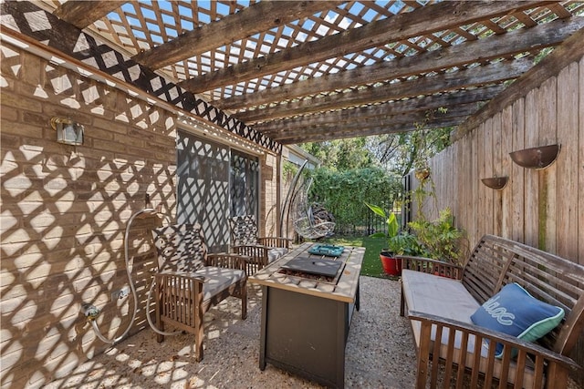 view of patio with a pergola and an outdoor living space with a fire pit