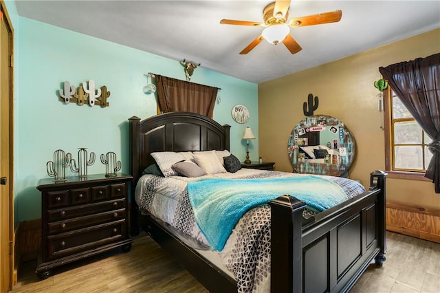 bedroom with light wood-type flooring and ceiling fan