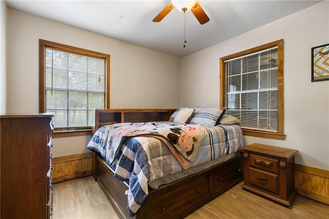 bedroom with ceiling fan and light hardwood / wood-style floors