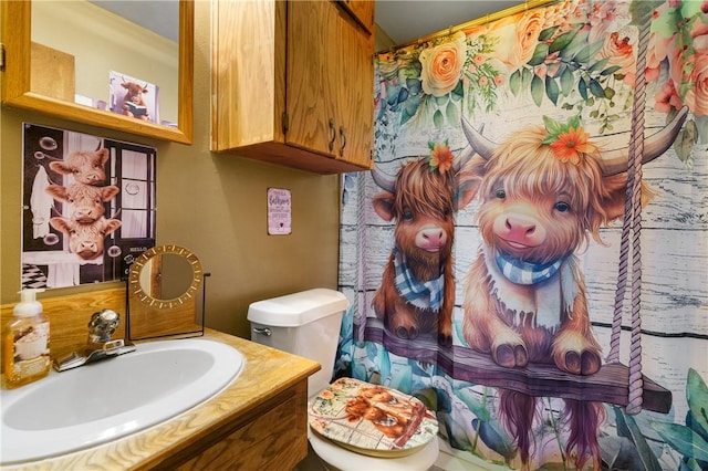 bathroom with vanity and toilet