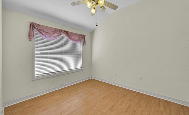 unfurnished room with light wood finished floors, baseboards, lofted ceiling, and ceiling fan